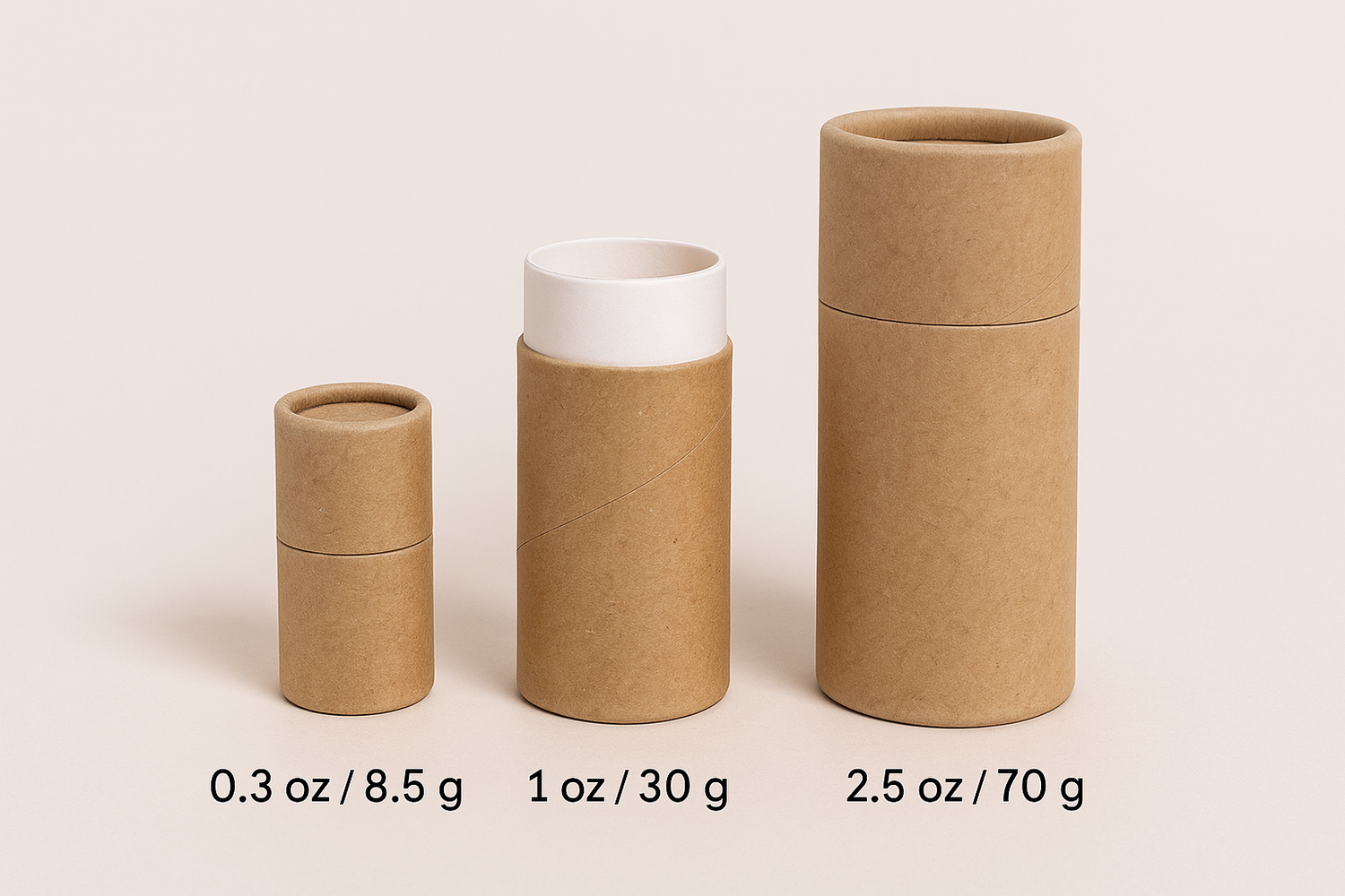 Three kraft push up paper tubes in different sizes for lip balm, deodorant, and body care products, displayed on a neutral background.