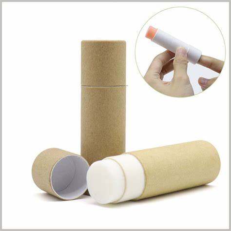 Push Up Paper Tube made of kraft paper, shown dispensing a solid balm stick by hand, ideal for deodorant or lip care packaging