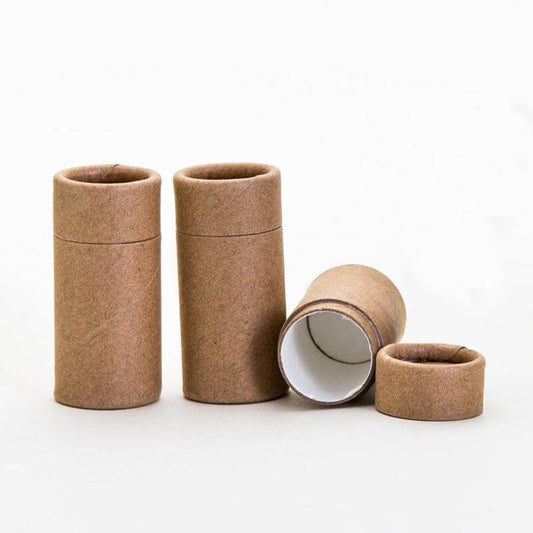 Brown paper tubes in various sizes, some standing and one tipped over, on a white background.